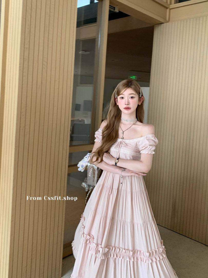 Light pink off-shoulder maxi dress worn by a model