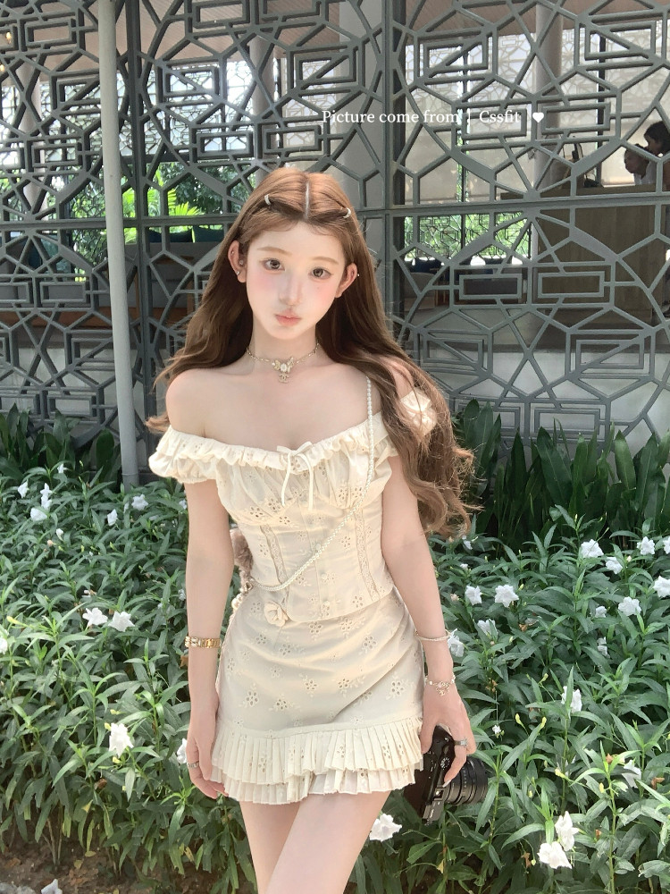 Cream off-shoulder mini dress worn by a model outdoors