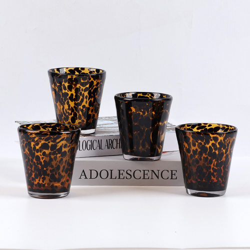Amber tortoiseshell round household glass, transparent wate