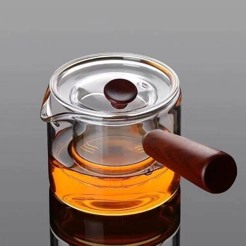 Side handle teapot with glass for tea brewing, filtering an