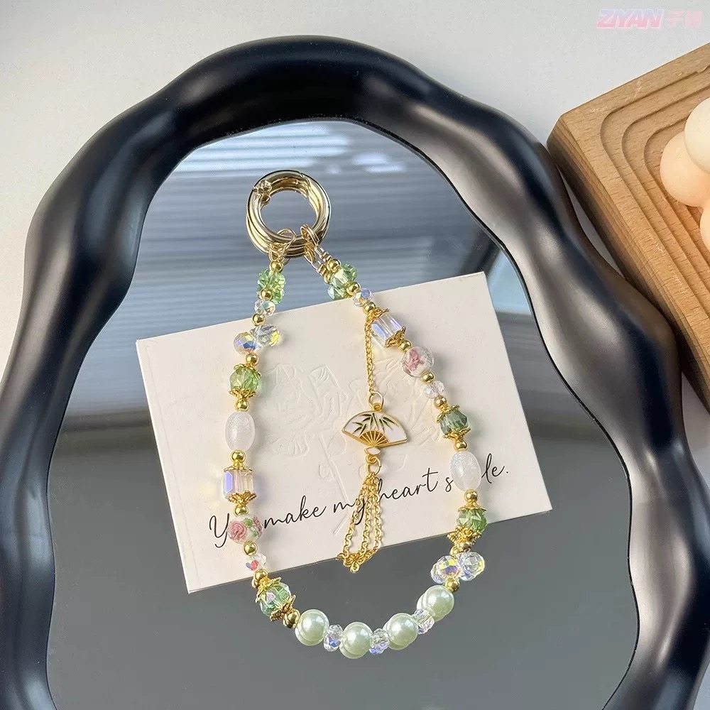 中国风流苏串珠手提链手腕短挂绳带夹片壳钥匙扣包包挂件女潮