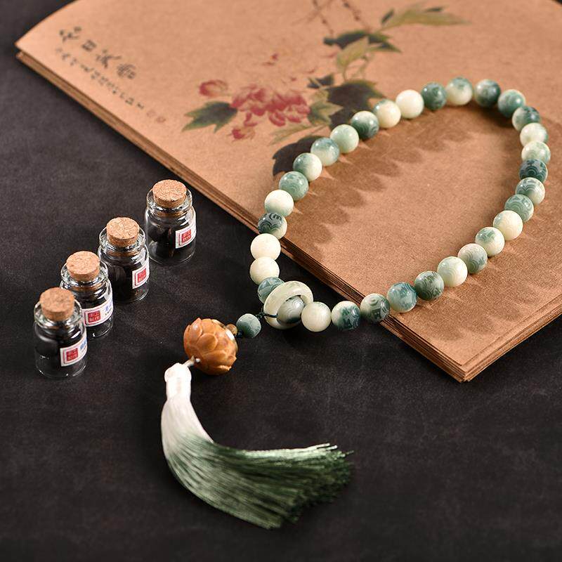 白玉菩提搭配绿檀木夜光香囊双圈手持带流苏 菩提根手串12mm