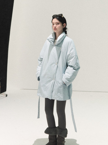 Light blue oversized puffer coat worn by a model