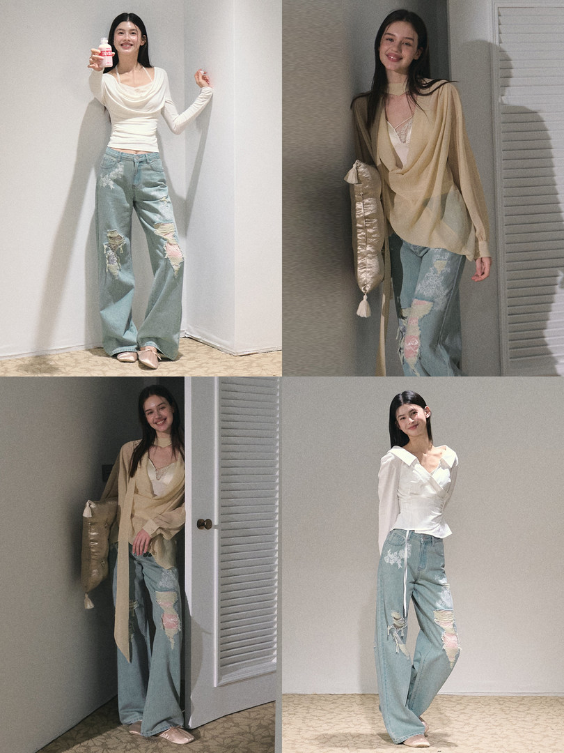 Model wearing a white draped long-sleeve top with light blue distressed wide-leg jeans