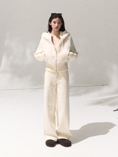 Cream fuzzy hooded zip-up sweater set with wide-leg pants worn by a model