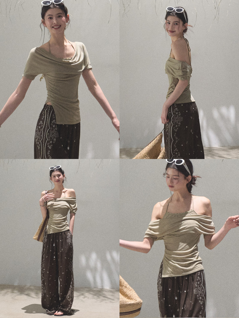 Model wearing an olive off-shoulder top with dark patterned wide-leg pants