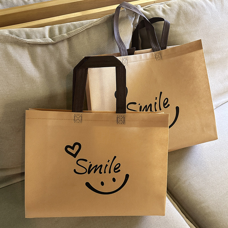 无纺布笑脸服装店手提袋子高级定制女装童装店购物袋加厚礼品袋