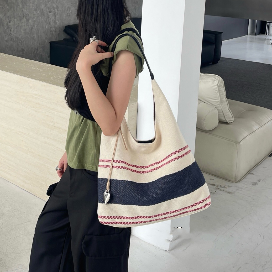 大容量通勤帆布托特包女2025新款高级感小众单肩包条纹休闲手提包