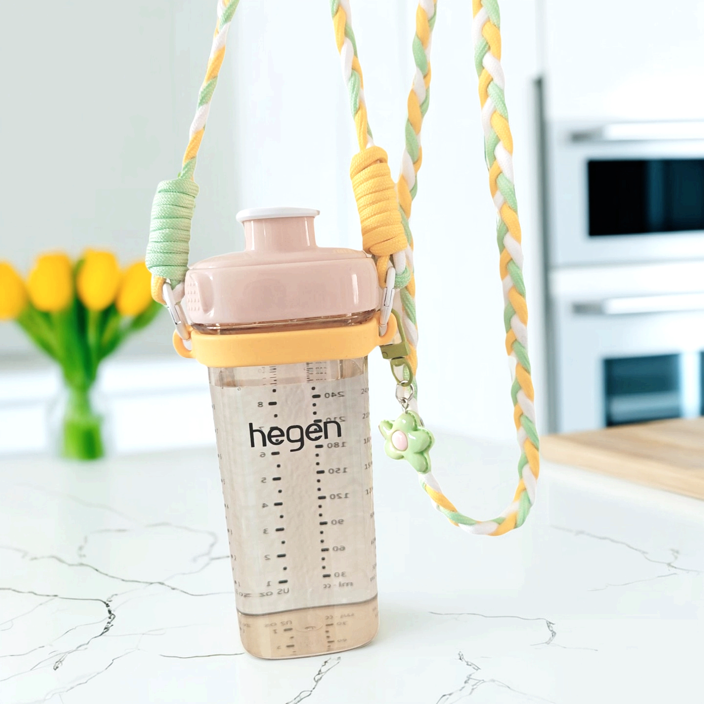适用hegen奶瓶杯套咖啡杯保护套背带可斜挎宝宝外出撞色编织长绳图片