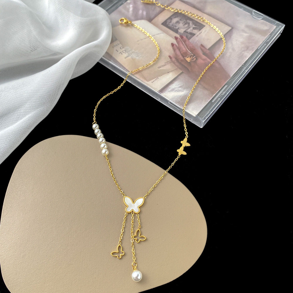 韩版白贝蝴蝶珍珠项链女钛钢镂空长流苏吊坠电镀金保色时尚锁骨链