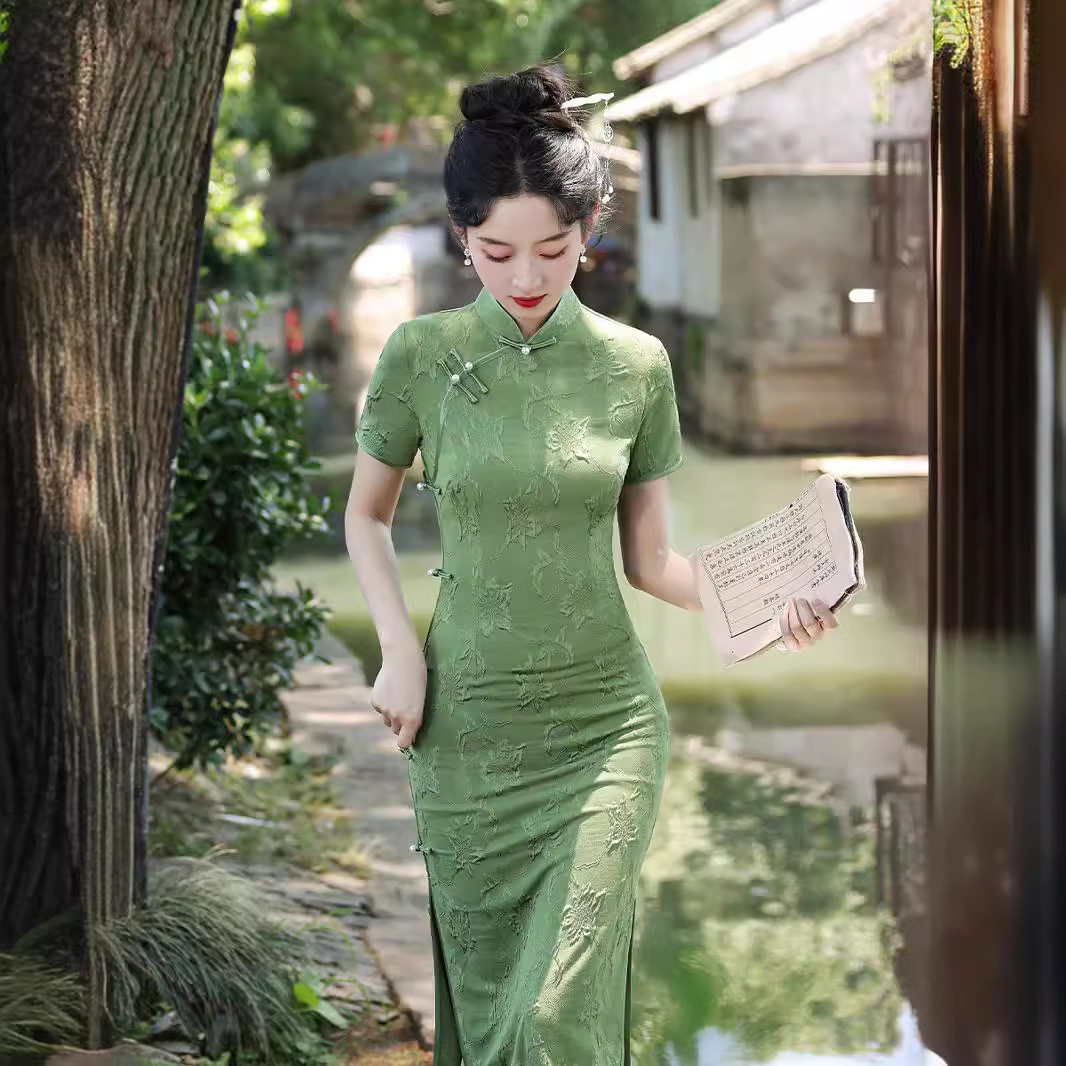 绿色弹力朱光棉旗袍2026夏季新款改良版连衣裙高端气质女礼服年轻