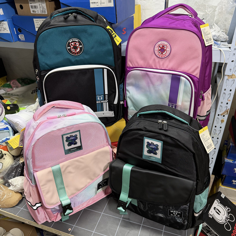 撤柜儿童双肩背包男女童轻便多口袋大容量小学生减负书包1-6年级