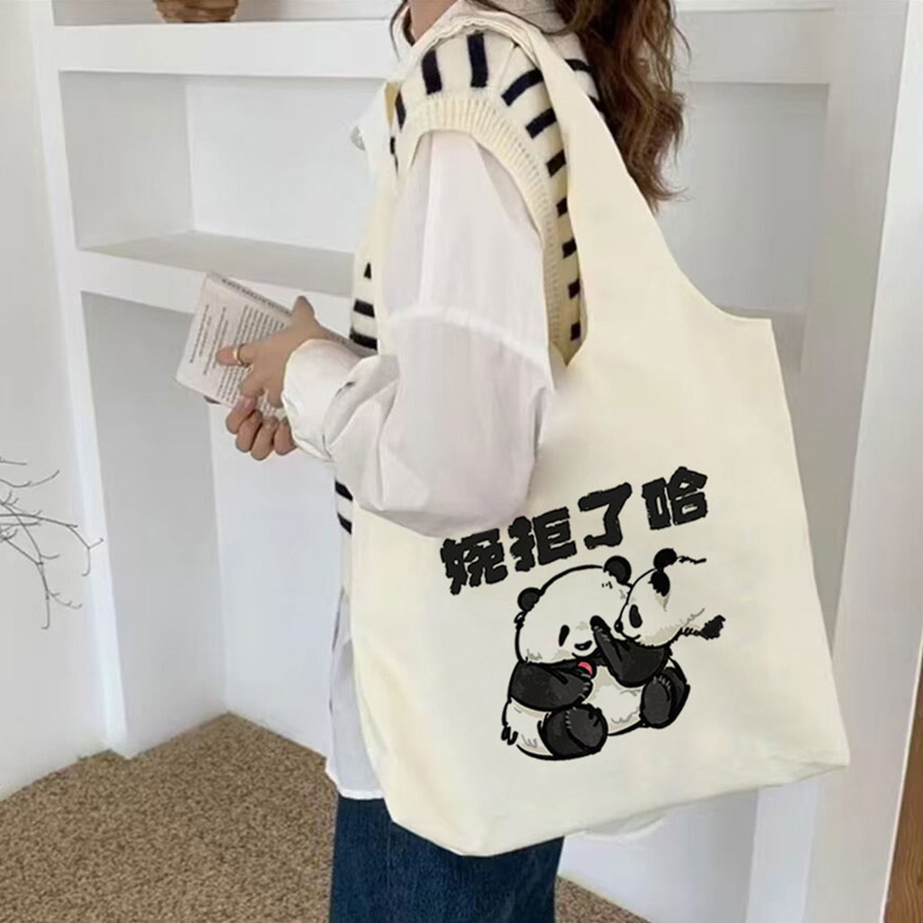 小众设计女士帆布包熊猫花花卡通托特包小红书通勤外出白色单肩包图片