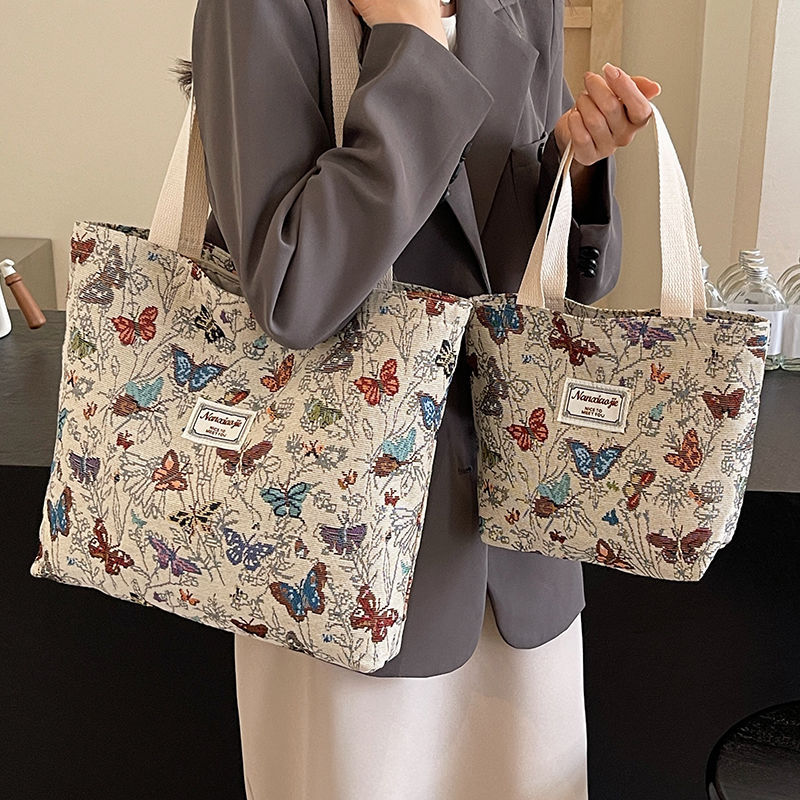 上班通勤帆布包包女2025新款ins时尚蝴蝶托特包单肩大容量妈咪包