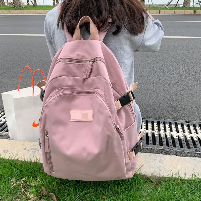 大容量纯色书包大学生背包女双肩夏简约日系百搭高中生小众电脑包