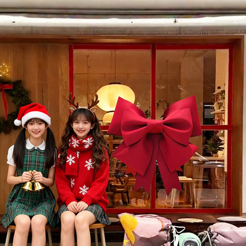 圣诞节店铺橱窗大蝴蝶结场景布置