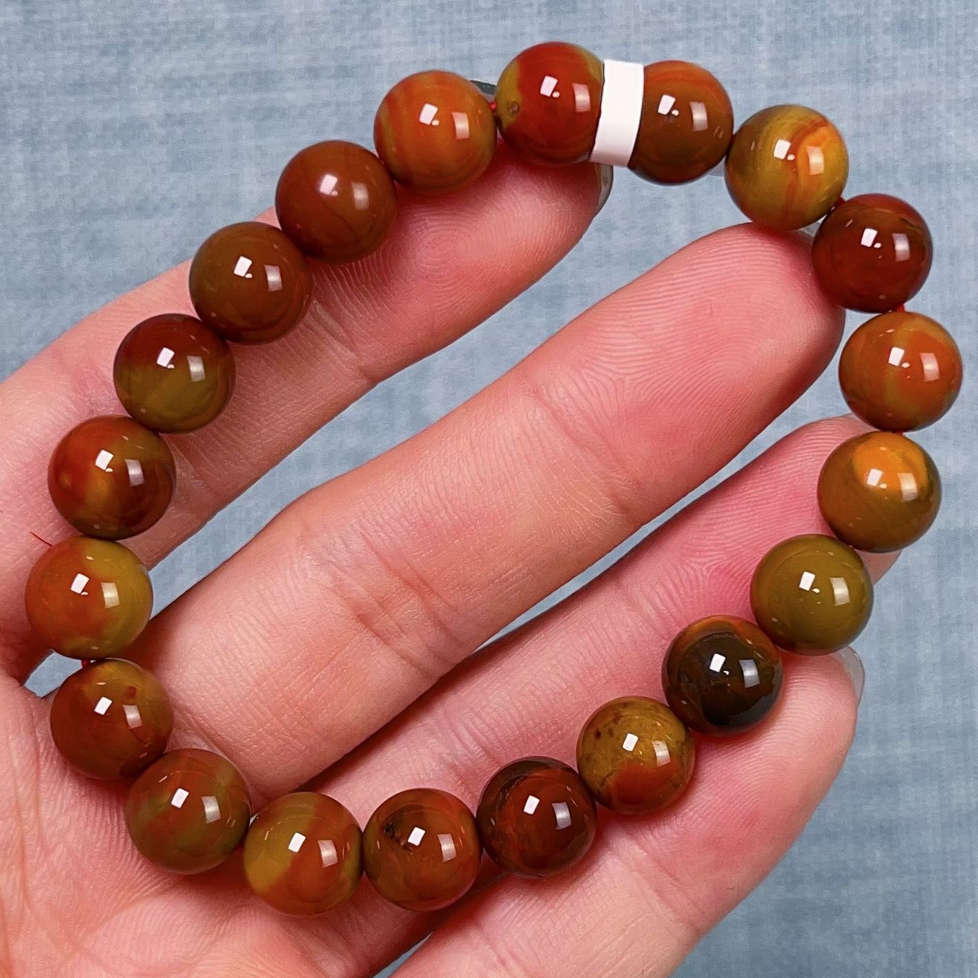 186F92大山包南红三彩包浆单圈手串