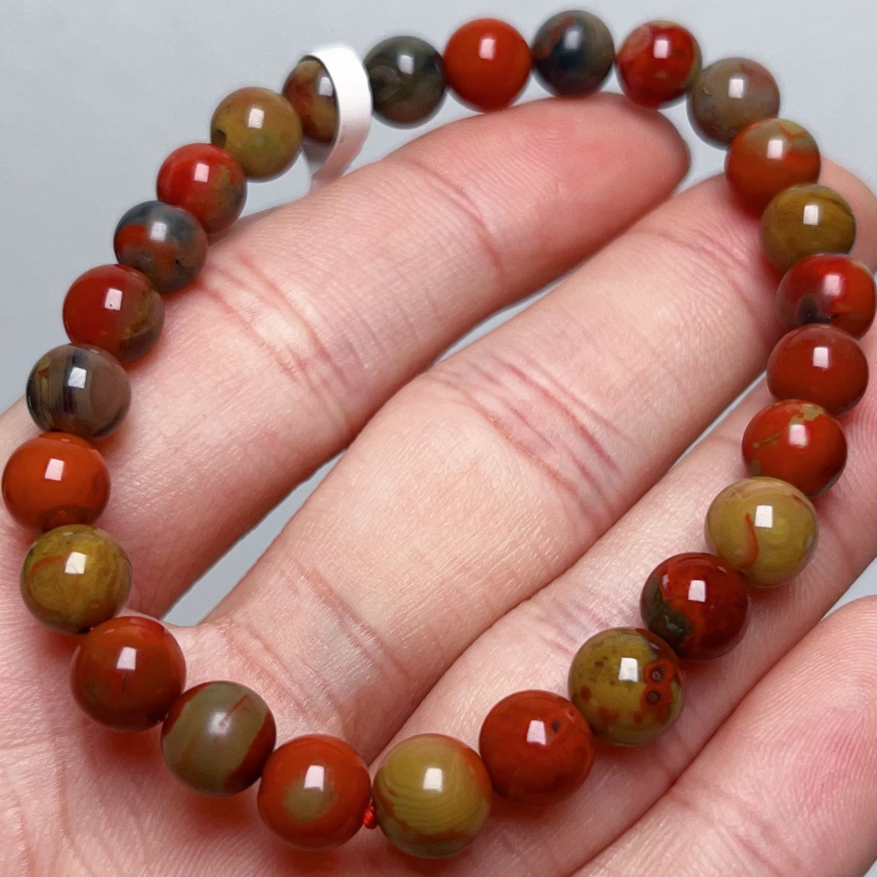 444A01大山包南红三彩包浆单圈手串