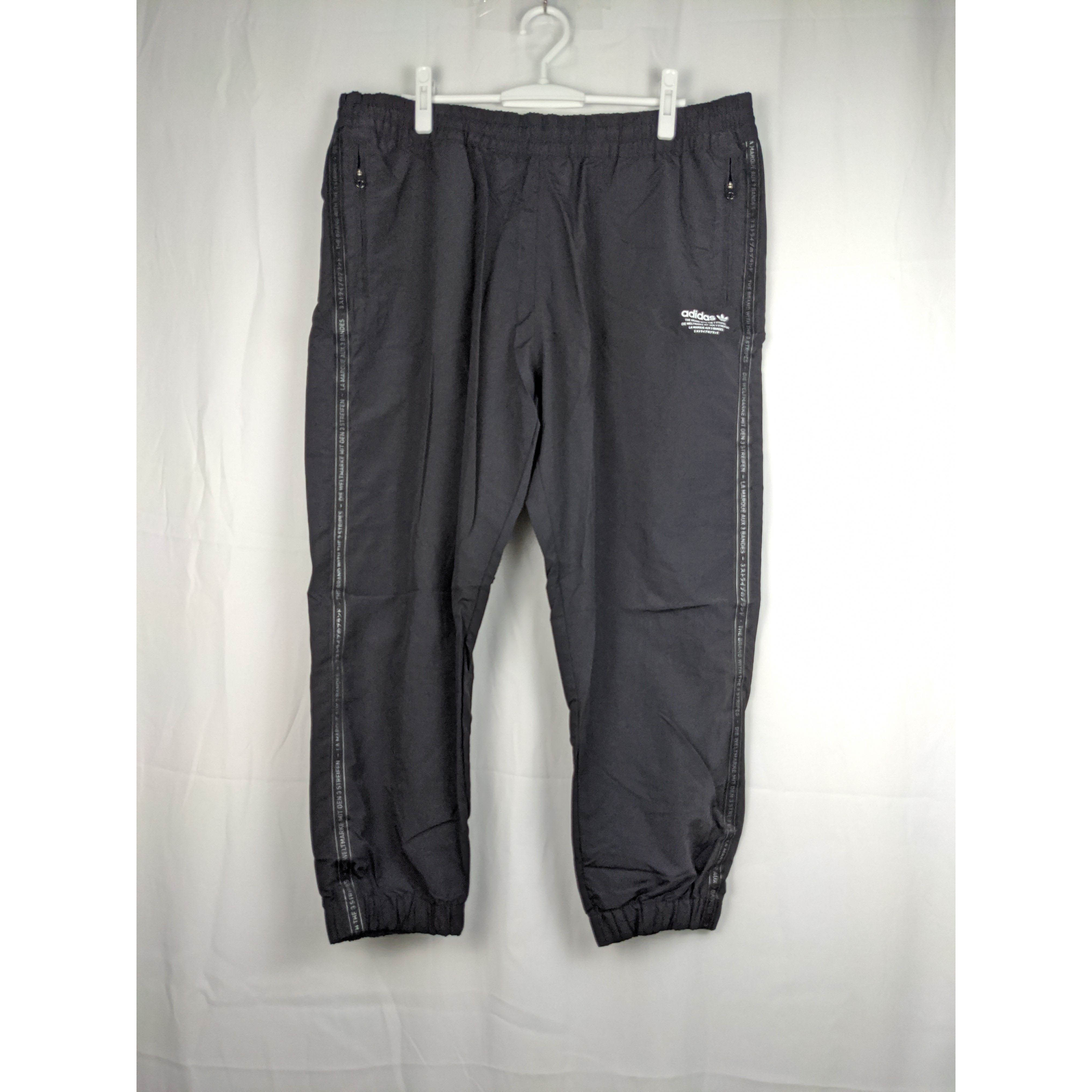 三叶草 adidas NMD Track Pants 男款防風材質休閒九分褲 CV5835