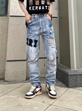 欧货男士牛仔裤破洞补丁刺绣五角星潮流弹力修身小脚贴皮休闲男裤