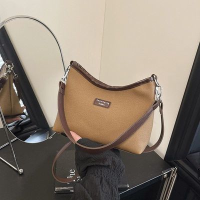 高级感帆布包包女式2025新款时尚单肩斜挎包百搭腋下包手提水桶包