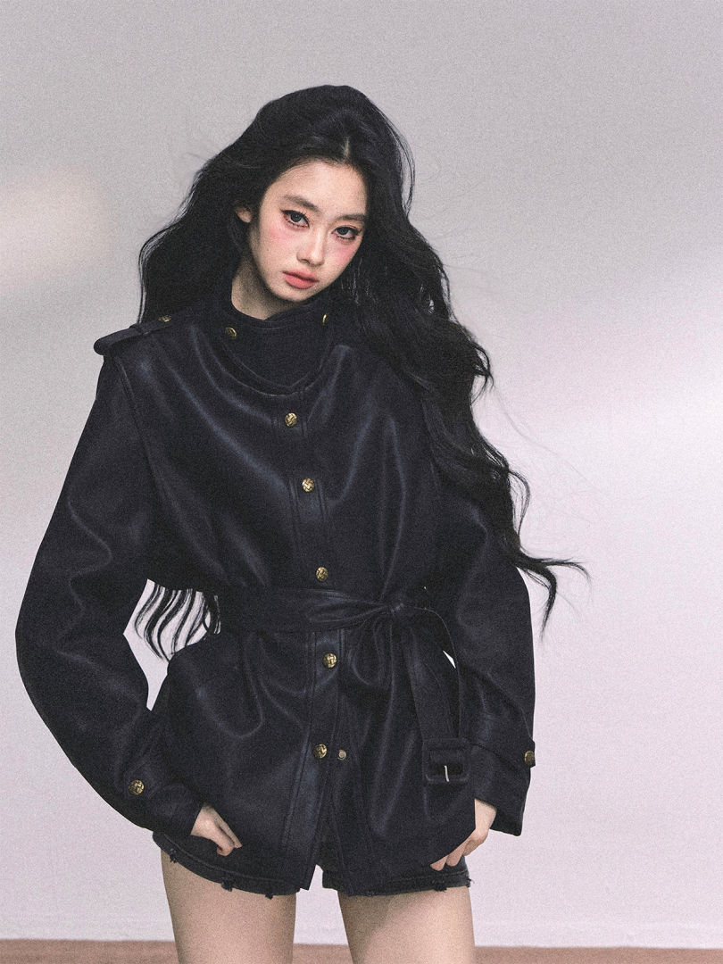 Black buttoned jacket worn by a model