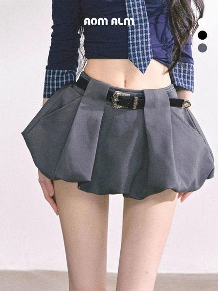 Gray pleated mini skirt with belt worn by a model