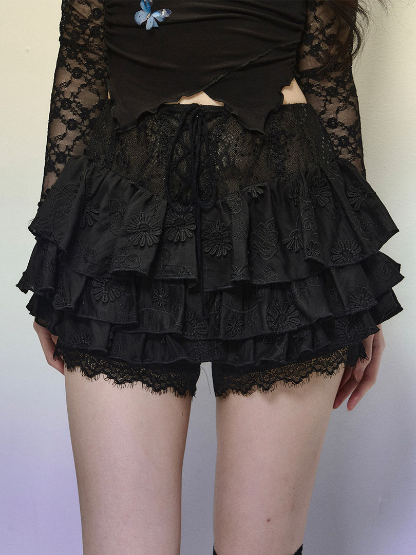Black layered lace ruffle shorts worn by a model