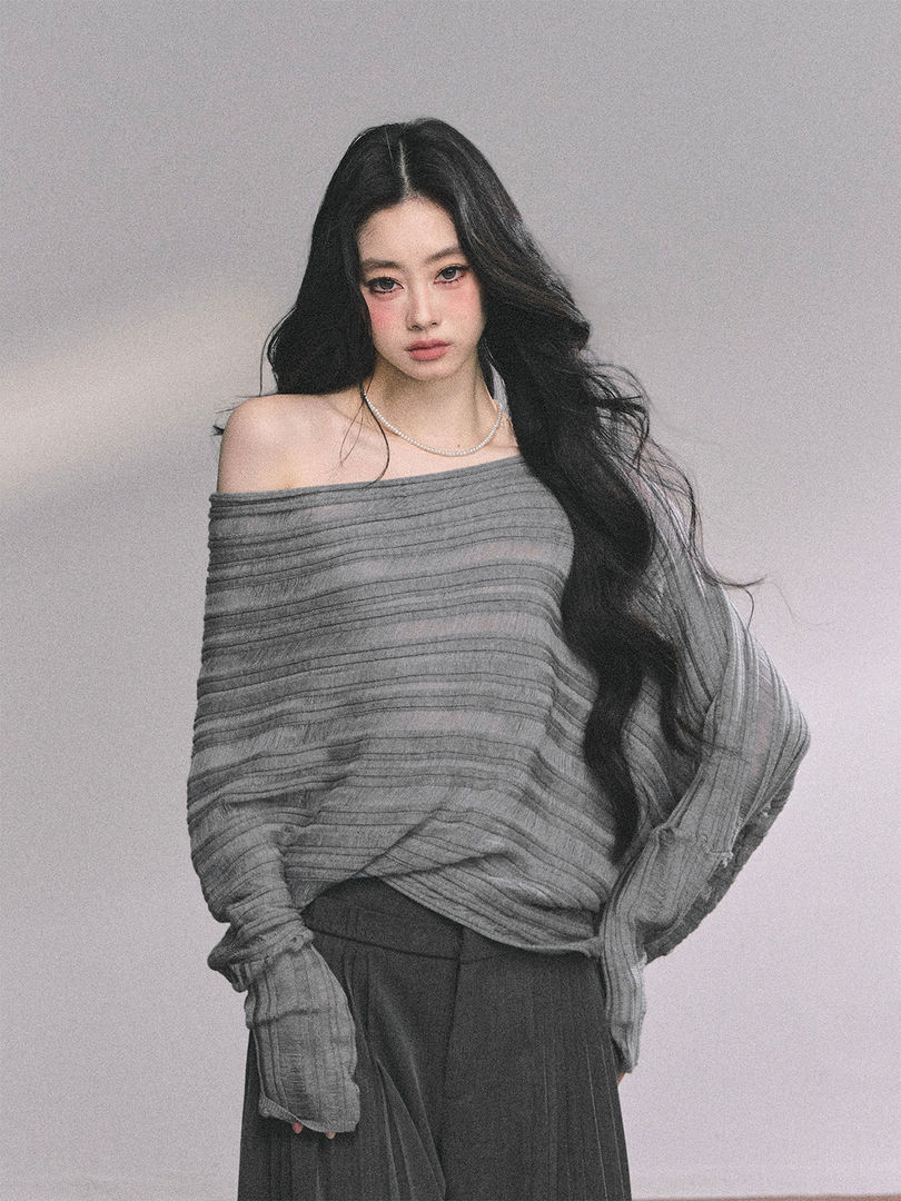 Gray off-shoulder long-sleeve top worn by a model