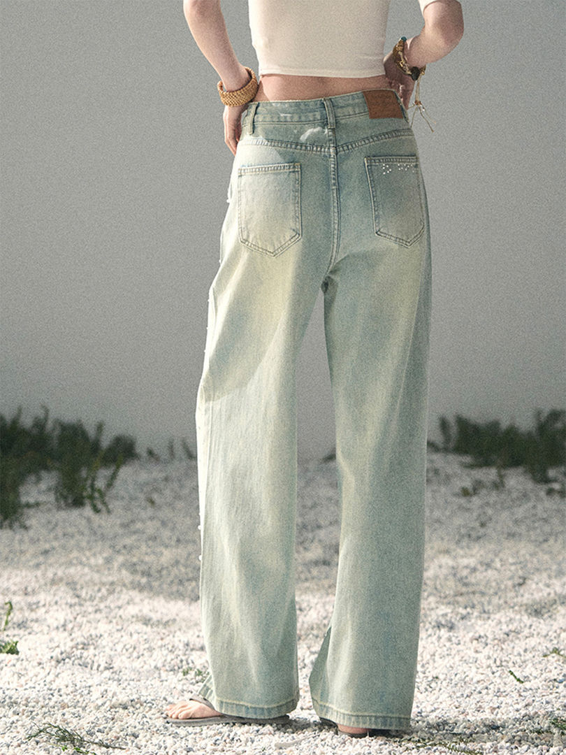 Light wash wide-leg jeans worn by a model outdoors