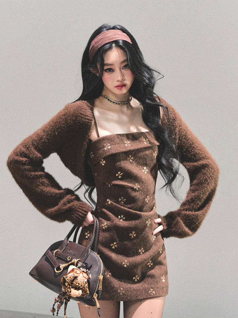 Model wearing a brown fuzzy mini dress with matching cardigan and handbag