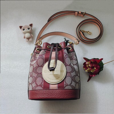 蔻驰Coach 女士Dempsey 帆布迷你水桶包 手提单肩斜跨包女士包袋