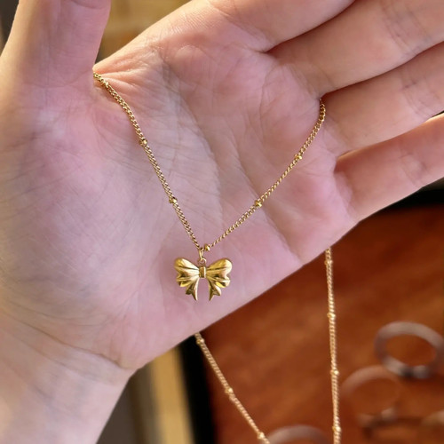 温婉柔美包金蝴蝶结项链
