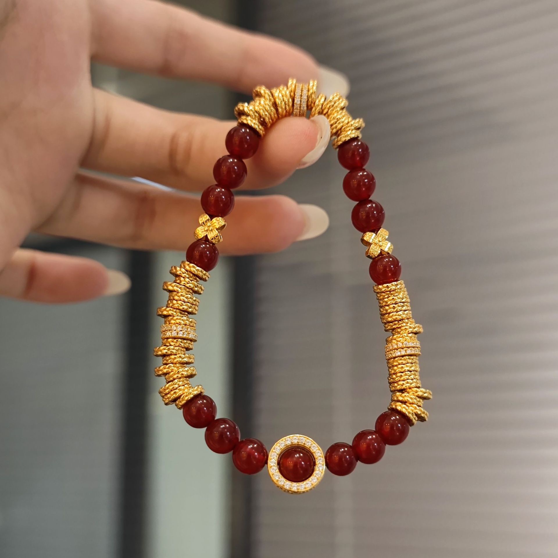 SSJEWELRY轻奢珠宝天然红玛瑙手串S925银镀金盘缠四叶草显白手链