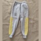 子浅灰色拼接下半截三条黄杠束脚运动裤 春秋款 中小学生男女校服裤