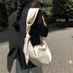 韩版夏季新款ins博主推荐帆布单肩包系带打结饺子包斜跨包女胸包