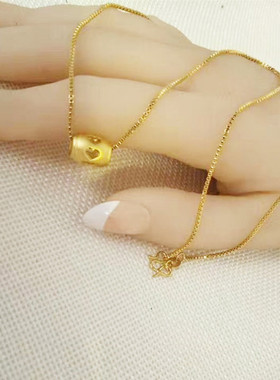 沙金路路通转运珠心形镂空吊坠