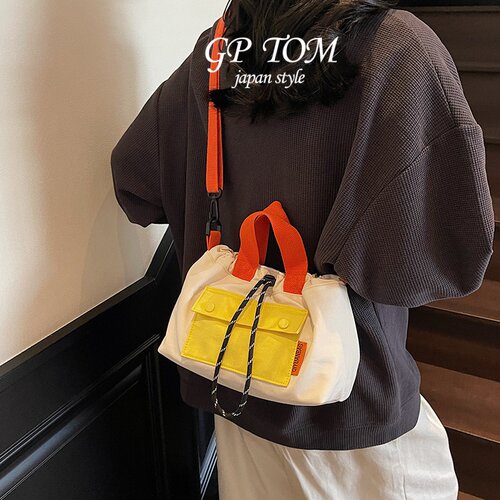 日本GP TOM加厚抽绳水桶包包女休闲通勤手提包潮大容量单肩斜挎包