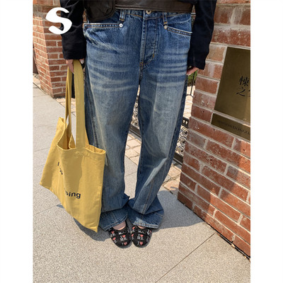 水洗肌理感做旧弧形弯刀牛仔裤