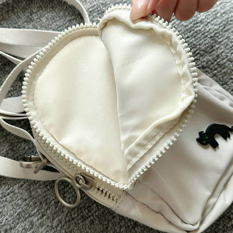 安踏黑猫迷你单肩包男女手机包斜挎包王一博休闲小背包192528111