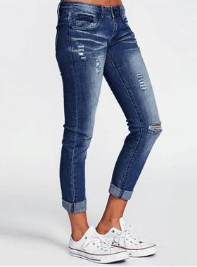 Women's jeans with holes repaired to make them look