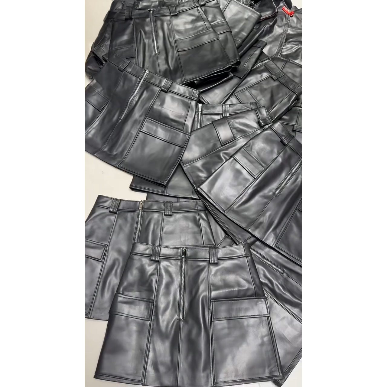 酷辣风新款真皮皮裙女黑色羊皮工装口袋短款A字裙辣妹短款半身裙