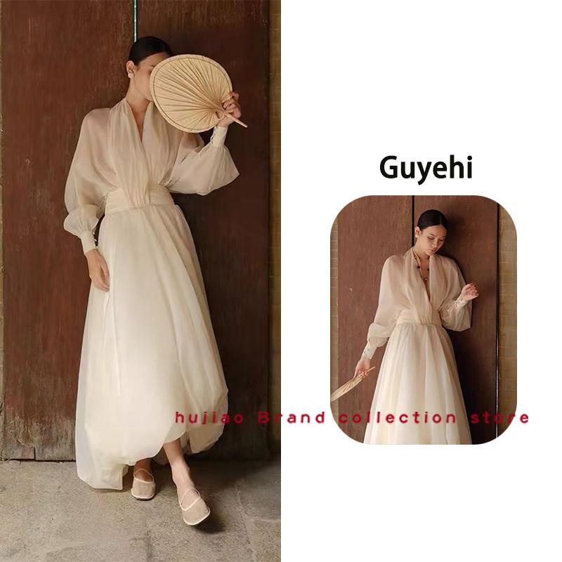 煳椒正品 Guyehi 新款法式度假风微透V领收腰长袖花苞长版洋装