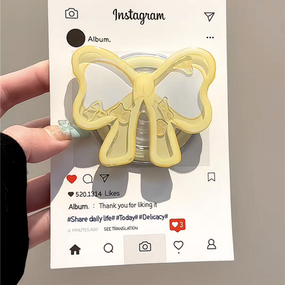 奶黄蝴蝶结摇摇乐磁吸支架适用MagSafe手机强力吸附桌面懒人支架