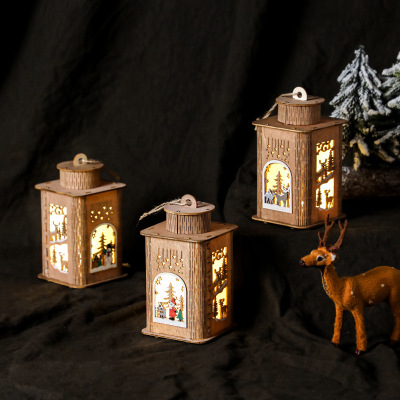 Christmas wooden house with lights, candle holders, desktop