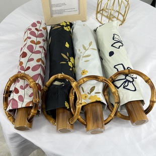 新品外商定制创意个性圆环竹手柄黑胶遮阳伞晴雨伞两用三折伞女神