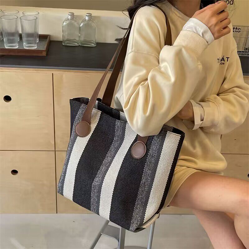 大容量包包女款爆款2026新款大学生上课包通勤托特单肩斜挎包