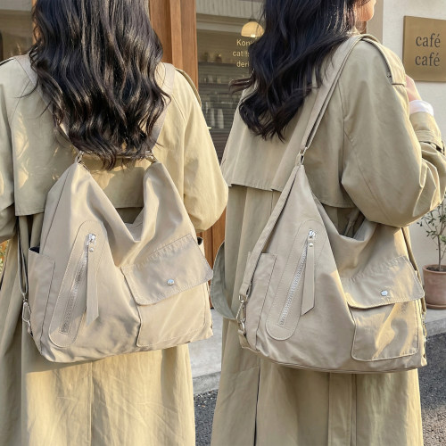 牧司女款大容量防水通勤双肩包