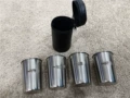 A Set of Four Cups + Leather Case