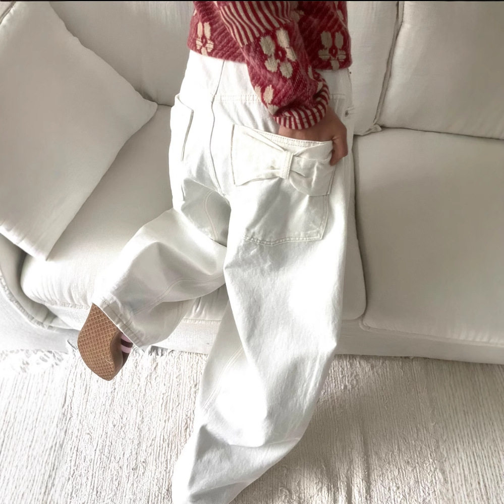 东大门2025春新品韩版设计感臀部口袋蝴蝶结宽松显瘦阔腿牛仔长裤